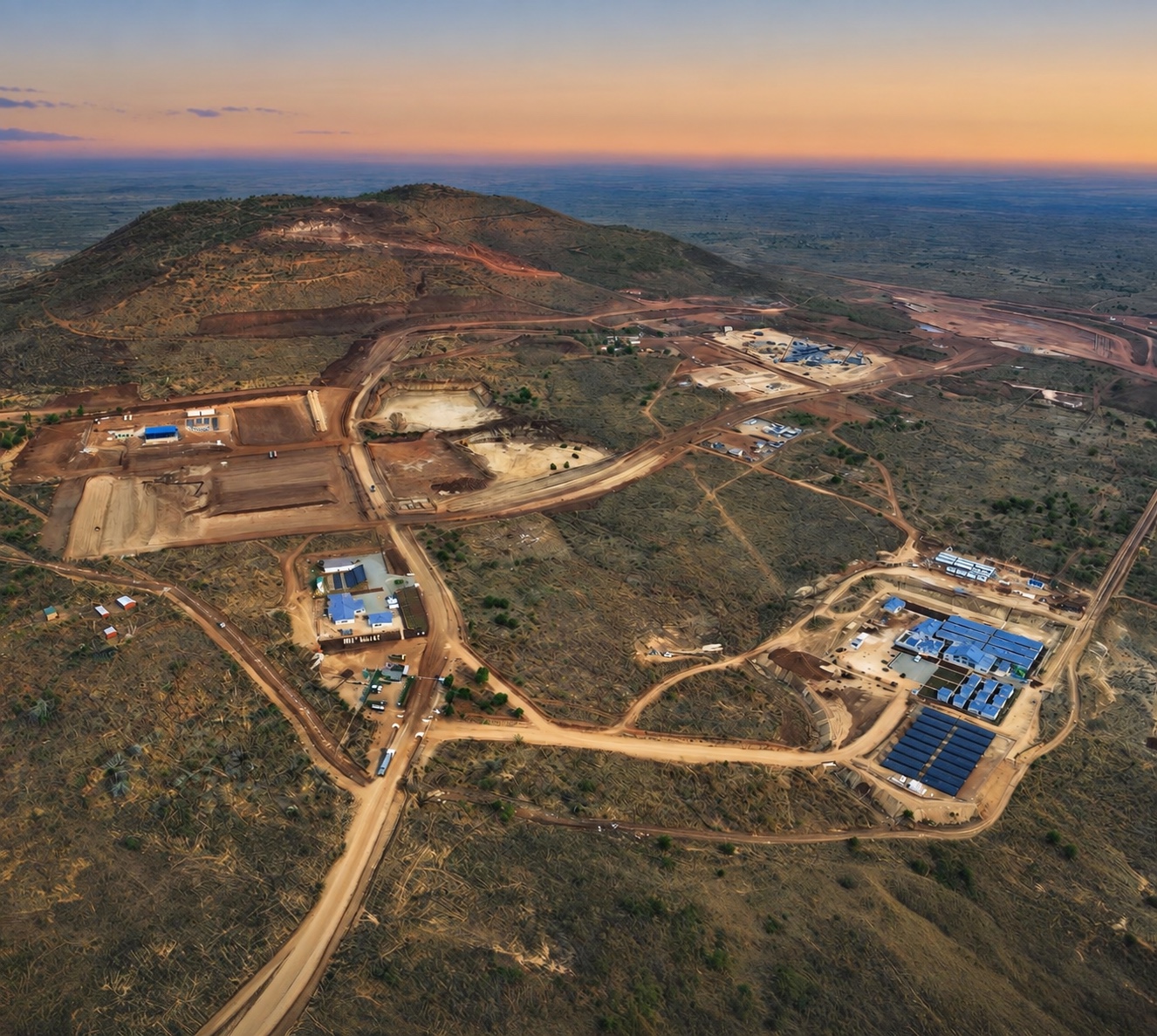 Aerial view of Kangankunde at sunset, showing the wider mining site, camp buildings and solar arrays